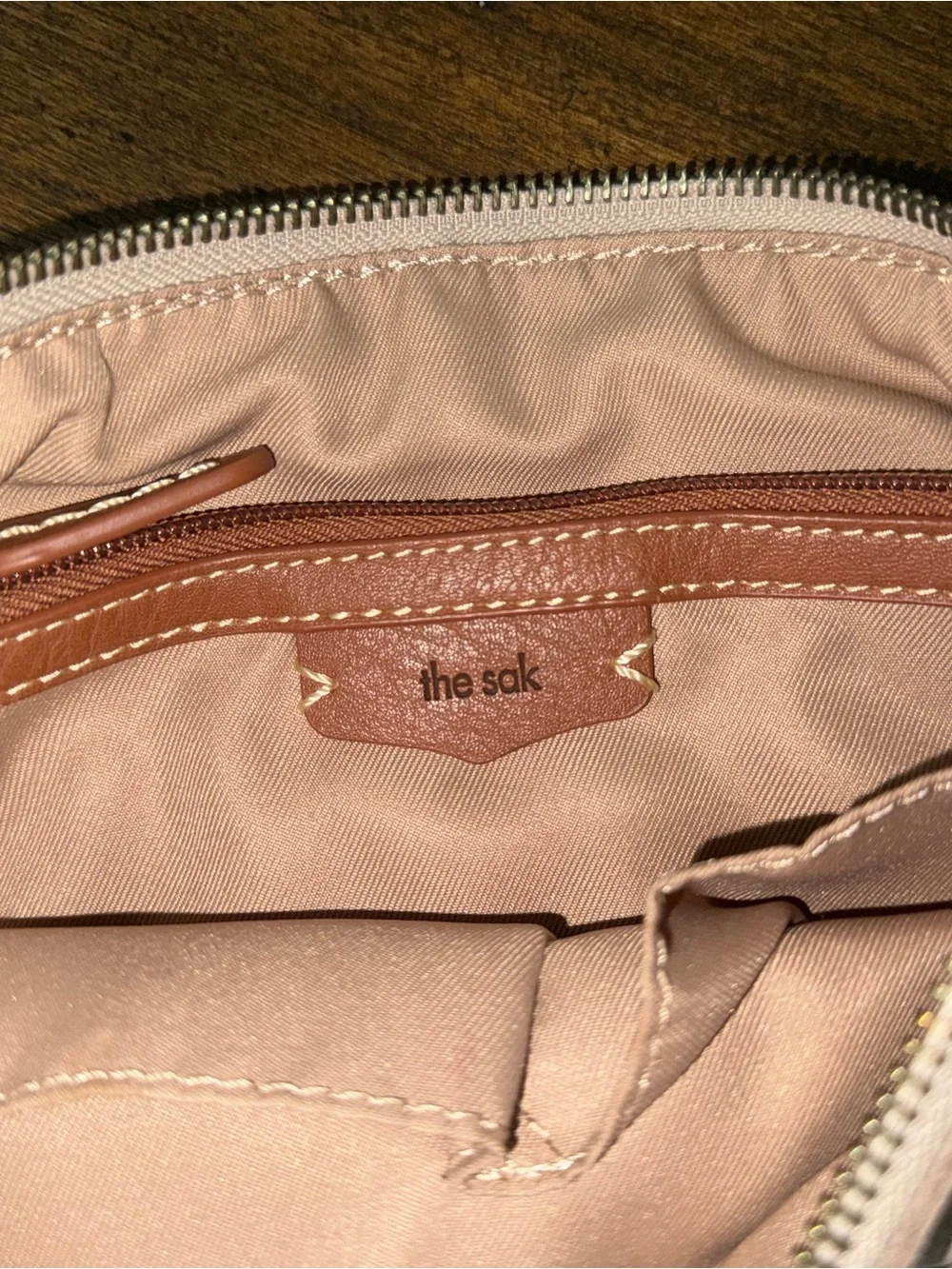 The Sak Soft Pebbled Cream Leather Crossbody with Charm Tassel